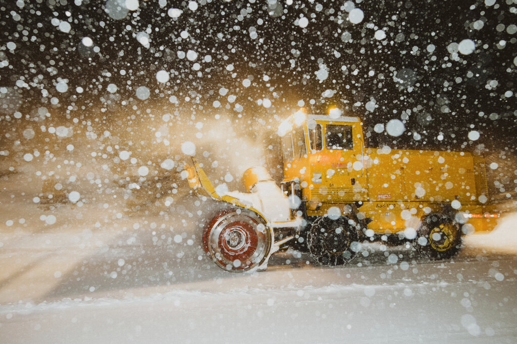 In this photo provided by the Mammoth Mountain Ski Area, a snowplow clears fresh snow at the Mammoth Mountain ski resort in Mammoth Lakes, Calif., on Monday, Dec. 13, 2021. (Peter Morning/Mammoth Mountain Ski Area via AP)