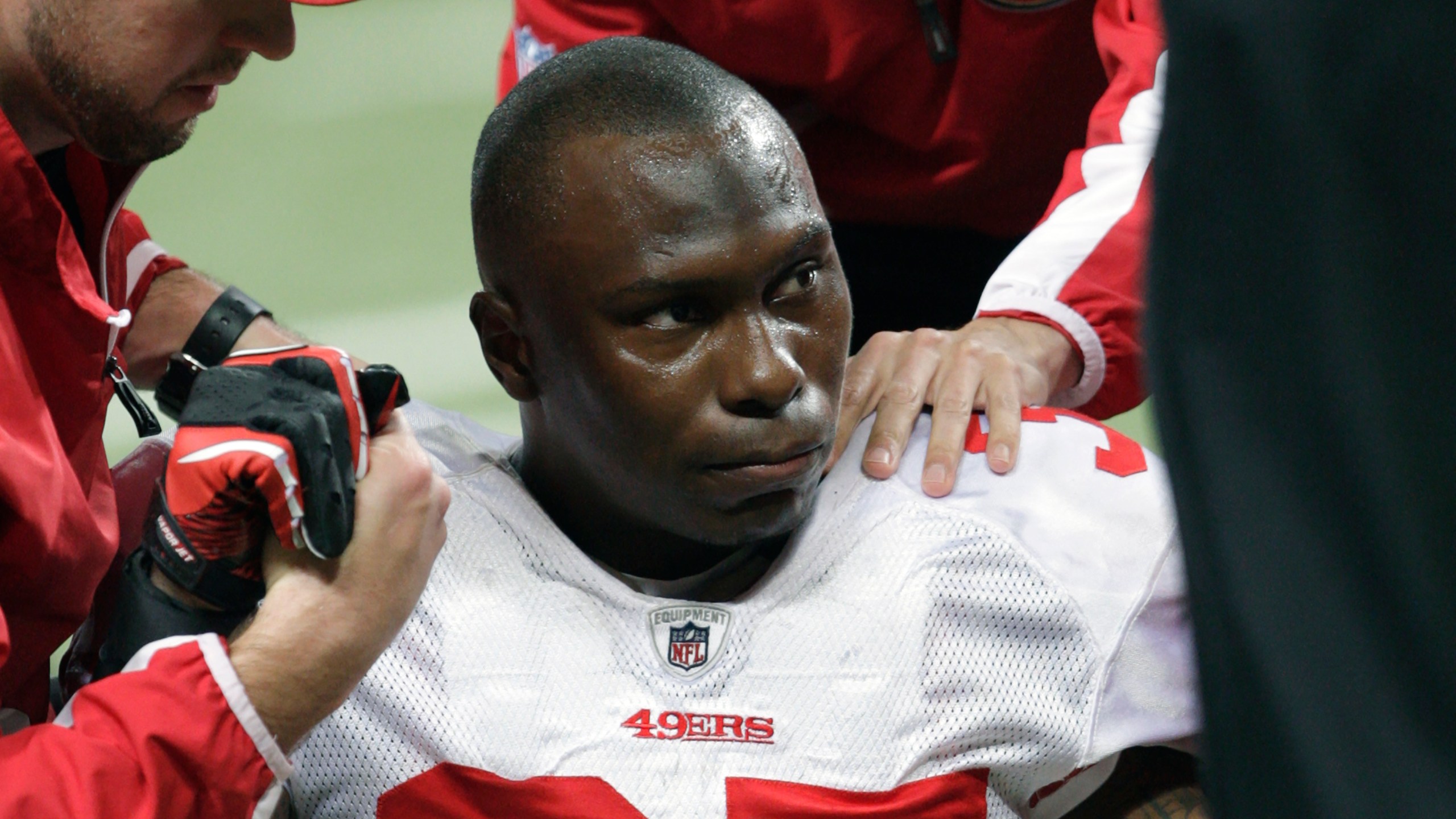 In this Dec. 26, 2010, file photo, San Francisco 49ers cornerback Phillip Adams (35) is attended to after injuring his left leg during the third quarter of an NFL football game against the St. Louis Rams, in St. Louis. On Tuesday, Dec. 14, 2021, a coroner is set to release the results of a brain test for chronic traumatic encephalopathy on former NFL player Adams, who was accused of fatally shooting six people in Rock Hill, South Carolina, before killing himself in April. Adams' family agreed after his death to have his brain tested for the degenerative disease linked to head trauma and concussions. (AP Photo/Tom Gannam, File)