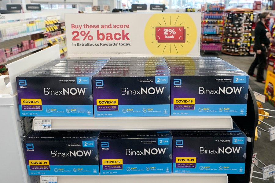 Boxes of BinaxNow home COVID-19 tests made by Abbott are shown for sale on Nov. 15, 2021, at a CVS store in Lakewood, Wash. (AP Photo/Ted S. Warren, File)