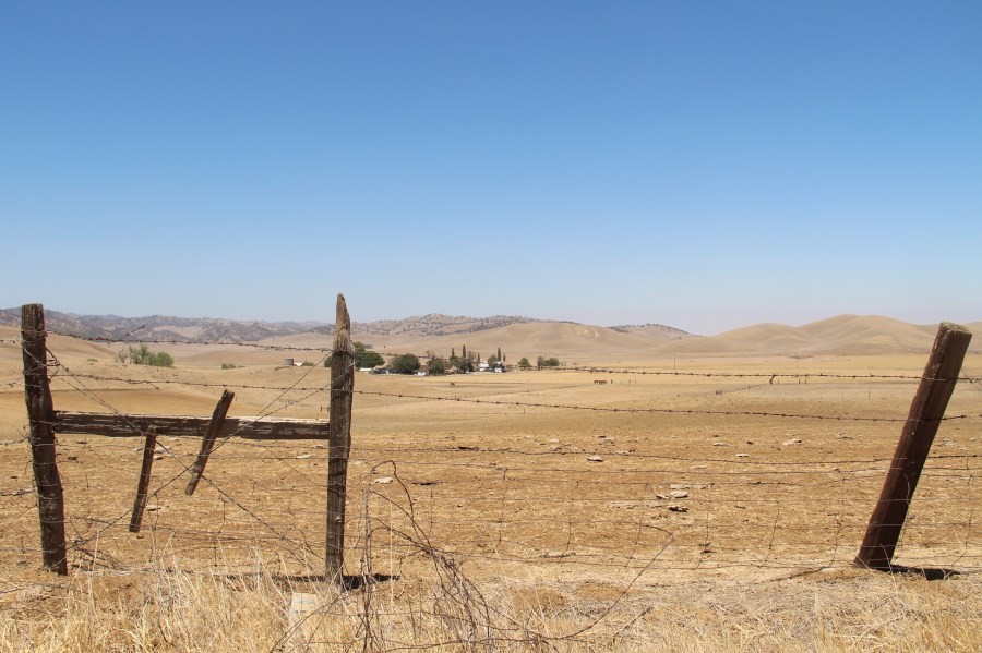 A barbed wire fence runs along a ranch in Sites, Calif., on July 23, 2021. This ranch would be underwater once the Sites Reservoir is completed. (AP Photo/Adam Beam, File)