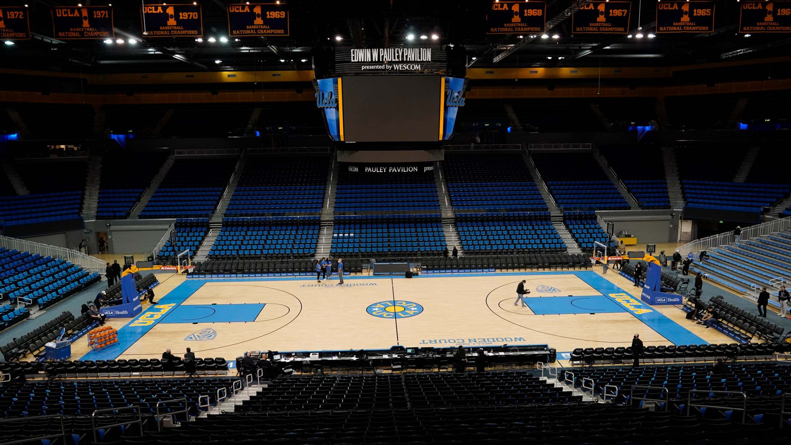 An empty Pauley Pavilion is seen before an NCAA college basketball game between UCLA and Alabama State Wednesday, Dec. 15, 2021, in Los Angeles. The game will not be played due to COVID-19 protocols. (AP Photo/Marcio Jose Sanchez)