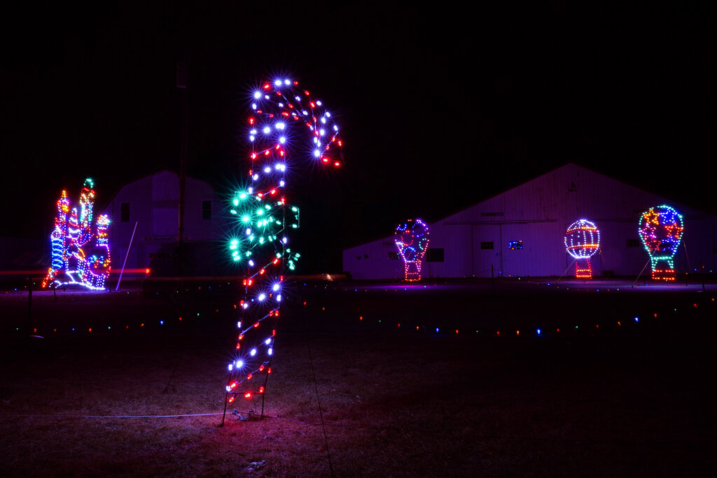 Decorative holiday lights are displayed at the Cumberland Fair Grounds, Tuesday, Dec. 14, 2021, in Cumberland, Maine. (AP Photo/Robert F. Bukaty)