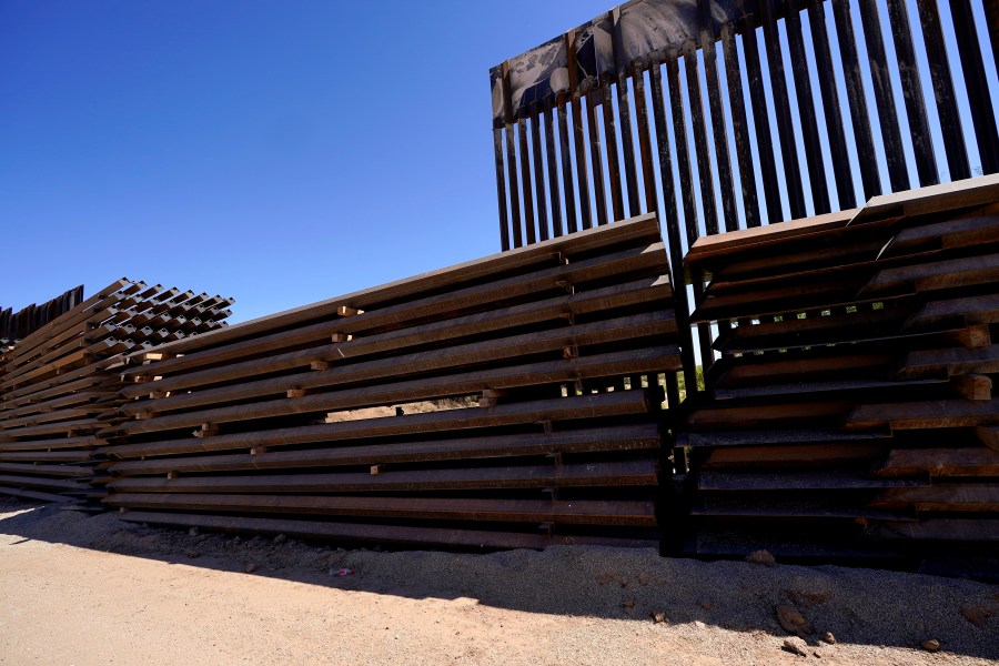 Abandoned border wall construction material is used to close a gap in the newly constructed border wall on May 19, 2021, near Sasabe, Ariz. The Department of Homeland Security Secretary Alejandro Mayorkas announced DHS will use border funding to close wall gaps in areas of Arizona, California and Texas by border construction started by the Trump administration. (Ross D. Franklin/Associated Press)