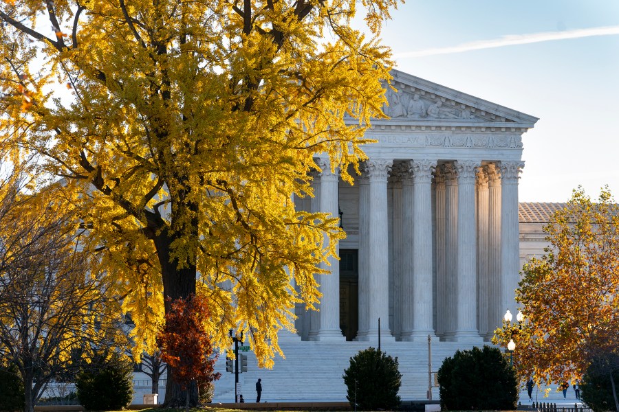 Light from the morning sun illuminates the Supreme Court on Friday, Dec. 3, 2021. (J. Scott Applewhite/Associated Press)