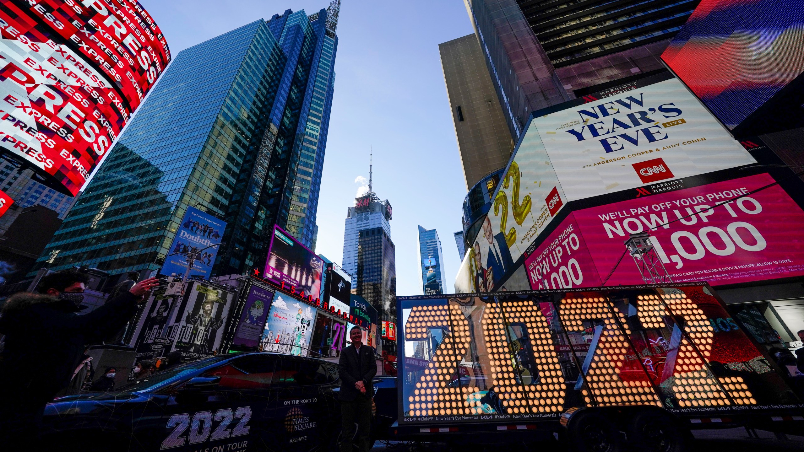 The 2022 sign that will be lit on top of a building on New Year's Eve is displayed in Times Square, New York on Dec. 20, 2021. Revelers will still ring in the new year in New York's Times Square next week, there just won't be as many of them as usual under new restrictions announced Dec. 23, 2021, as the city grapples with a spike in COVID-19 cases. (AP Photo/Seth Wenig, File)