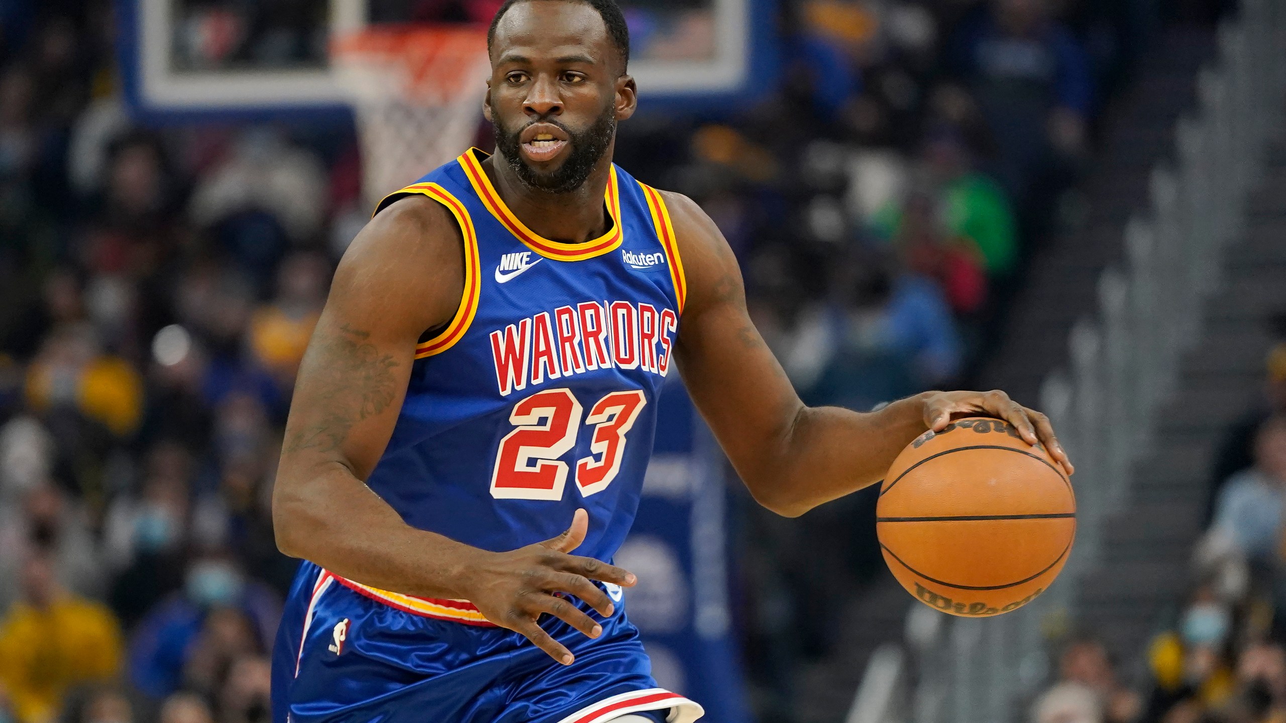 Golden State Warriors forward Draymond Green (23) dribbles the ball up the court against the Memphis Grizzlies during the first half of an NBA basketball game in San Francisco, Thursday, Dec. 23, 2021. (AP Photo/Jeff Chiu)