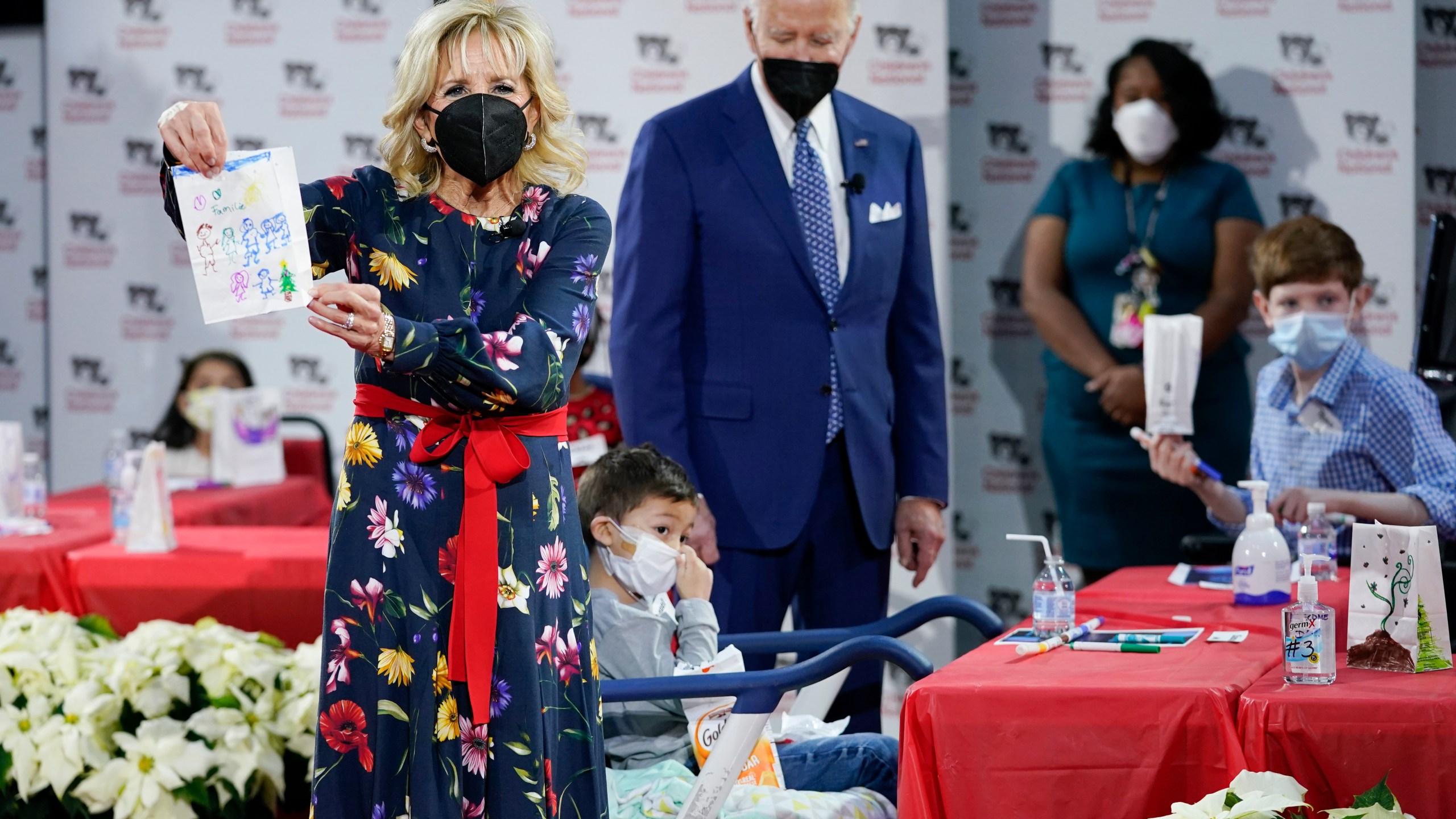 First Lady Jill Biden displays a lantern made by a patient at Children's National Hospital as part of a winter craft project as she and President Joe Biden visit patients in Washington, Friday, Dec. 24, 2021. (AP Photo/Carolyn Kaster)