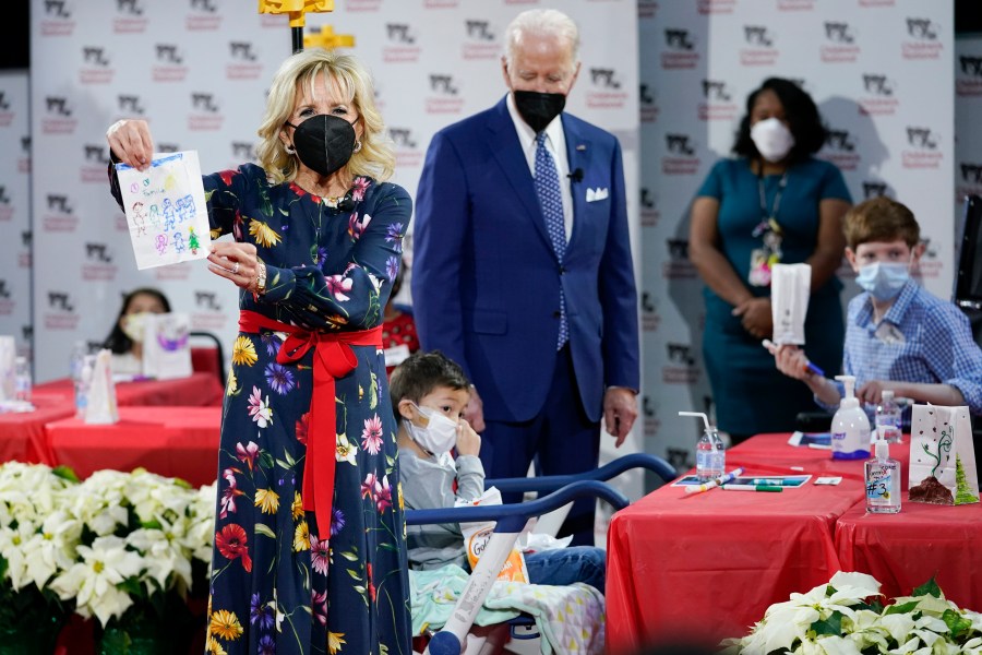 First Lady Jill Biden displays a lantern made by a patient at Children's National Hospital as part of a winter craft project as she and President Joe Biden visit patients in Washington, Friday, Dec. 24, 2021. (AP Photo/Carolyn Kaster)