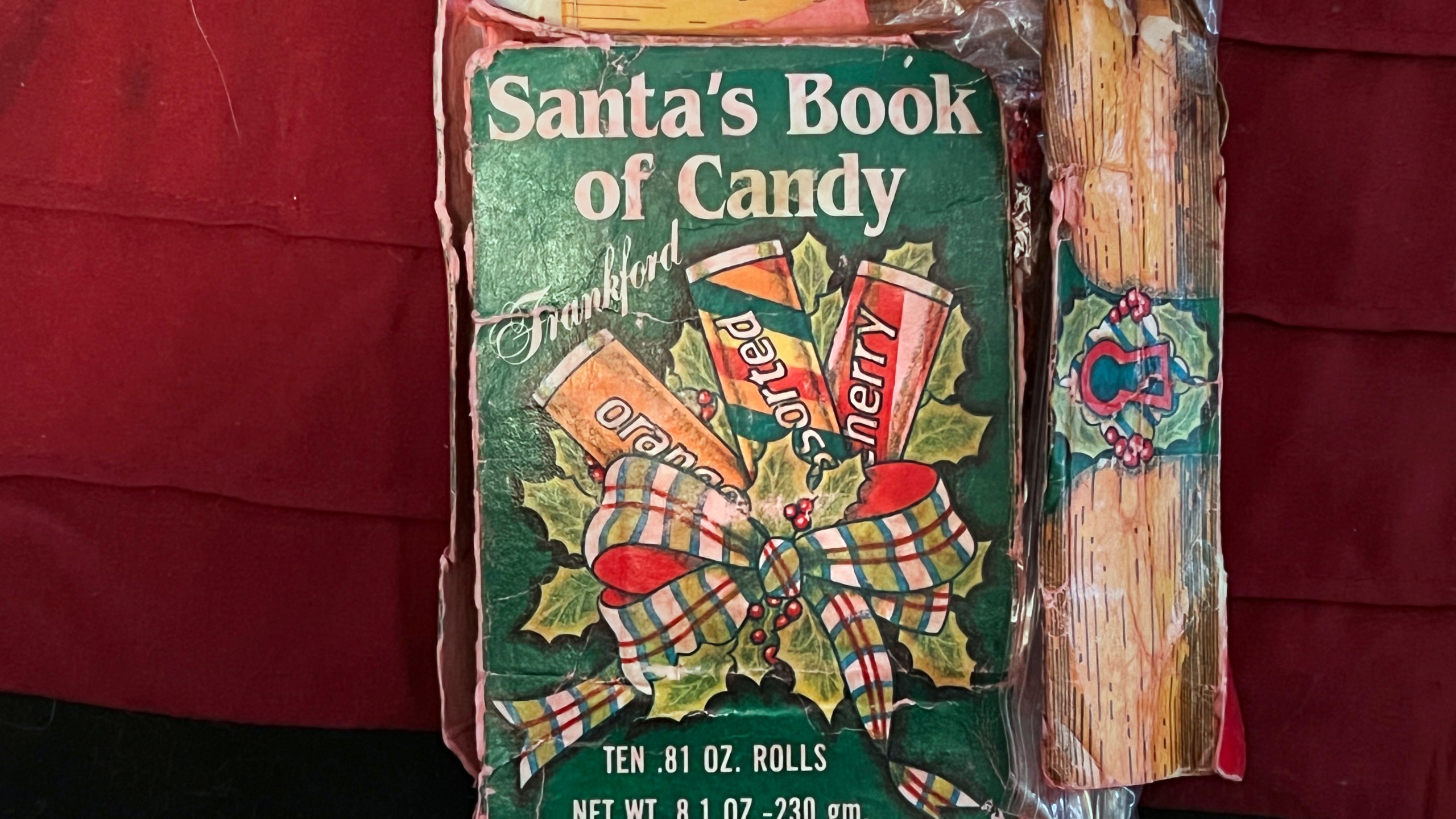 This Ryan Wasson family photograph shows a box of "Santa's Book of Candy," which contains 10 rolls of candy, on Dec. 18, 2021, in Ossipee, N.H. Two New Hampshire brothers have gotten their holiday regifting skills down to an art, and have been passing the same hard candy treats back and forth for over 30 years. Starting in 1987, Ryan Wasson gave the treat to his brother Eric Wasson as a joke for Christmas, knowing that Eric wouldn't like it. (Ryan Wasson family photograph via AP)