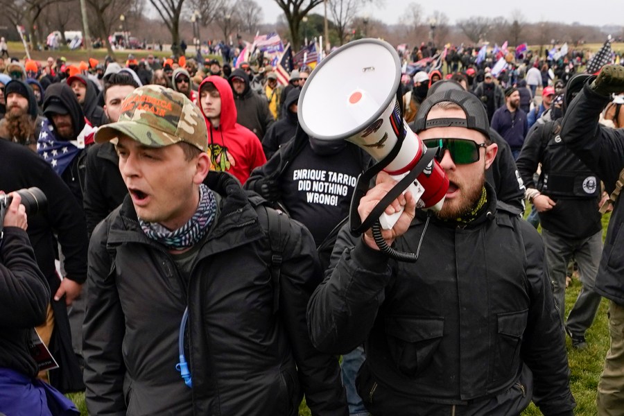 Proud Boys members Zachary Rehl, left, and Ethan Nordean, left, walk toward the U.S. Capitol in Washington, in support of President Donald Trump on Jan. 6, 2021. (Carolyn Kaster/Associated Press)