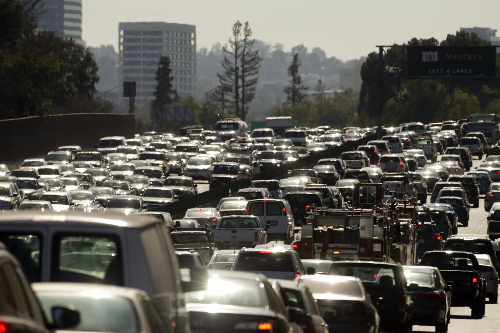 In this 2015 file photo, traffic slowly moves along the 101 Freeway during afternoon rush hour in Los Angeles. (AP Photo/Jae C. Hong)