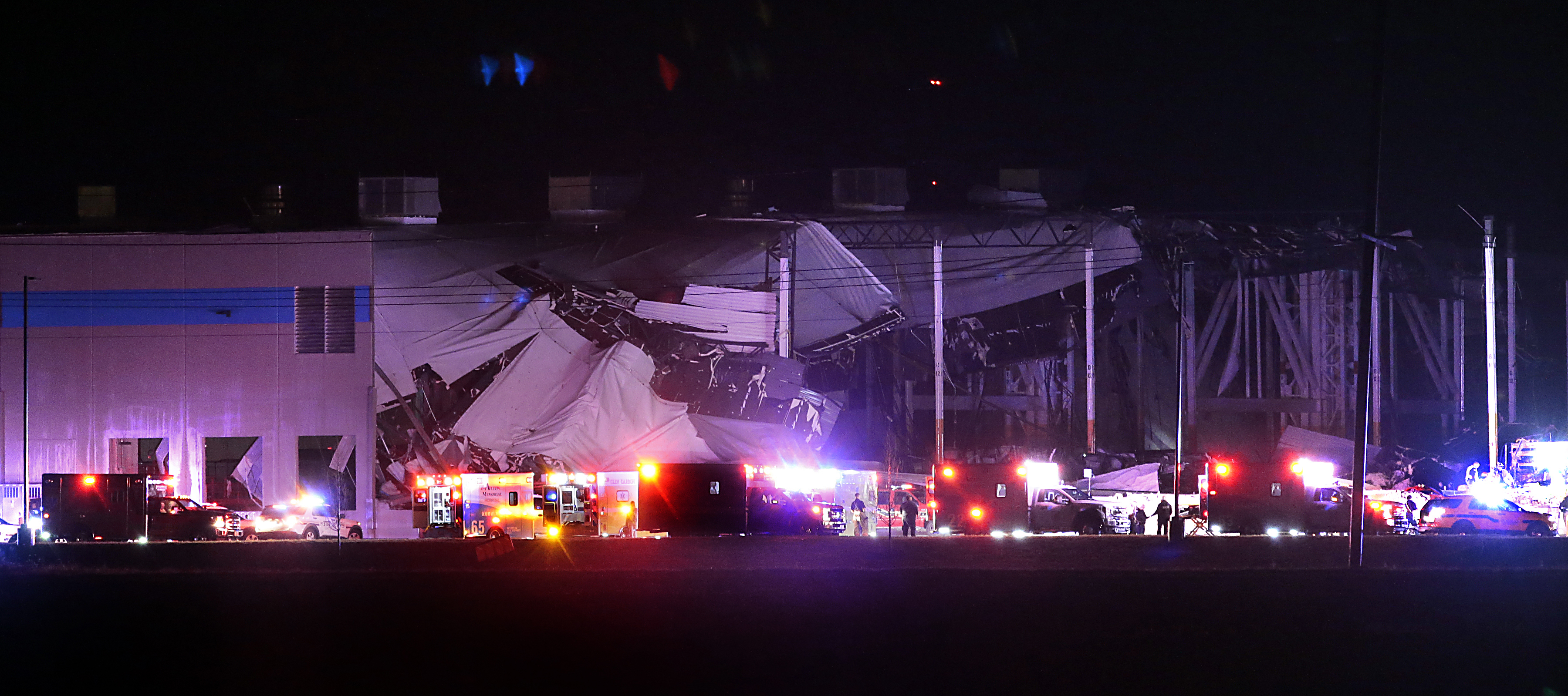 The Amazon distribution center is partially collapsed after being hit by a tornado on Friday, Dec. 10, 2021 in Edwardsville, Ill. (Robert Cohen/St. Louis Post-Dispatch via AP)