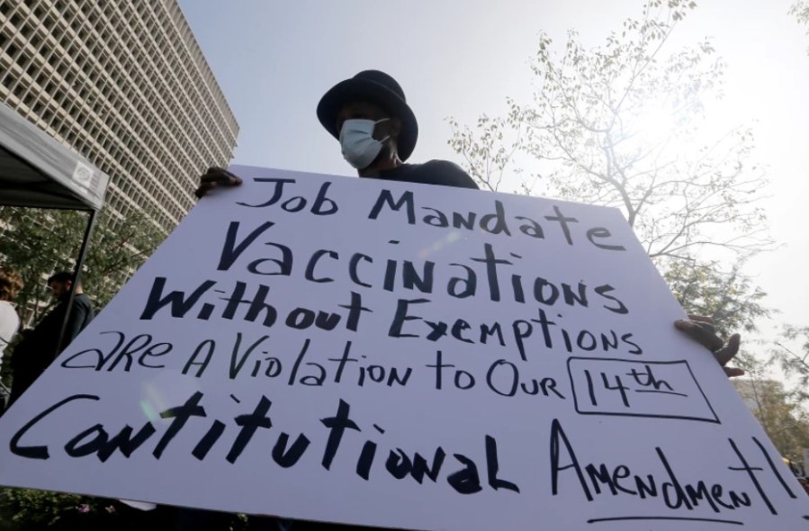 A man protests vaccination mandates at Grand Park in downtown Los Angeles last month. (Luis Sinco/Los Angeles Times)