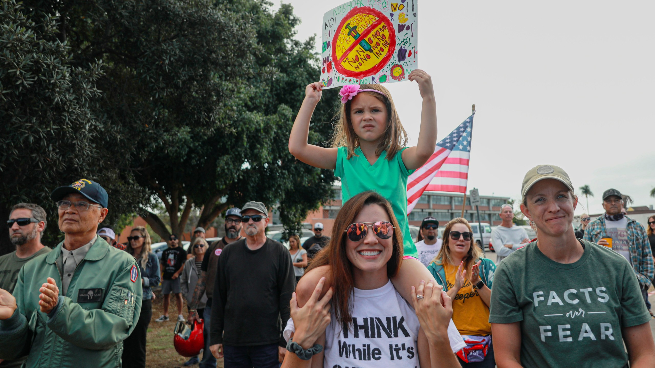 Anti-vaccine protesters stage a protest outside of the San Diego Unified School District office to protest a vaccination mandate for students on Sept. 28, 2021 in San Diego. (Sandy Huffaker/Getty Images)