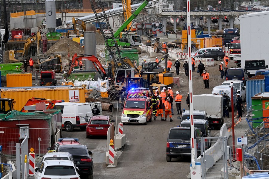 Fire brigades and policemen work at the site of a bomb explosion close to the main railway station in Munich, southern Germany, on December 1, 2021. - According to media reports, four persons were injured, one of them seriously, when a Word War II bomb exploded as works were under way at a construction site close to the railway station. (Photo by CHRISTOF STACHE / AFP) (Photo by CHRISTOF STACHE/AFP via Getty Images)