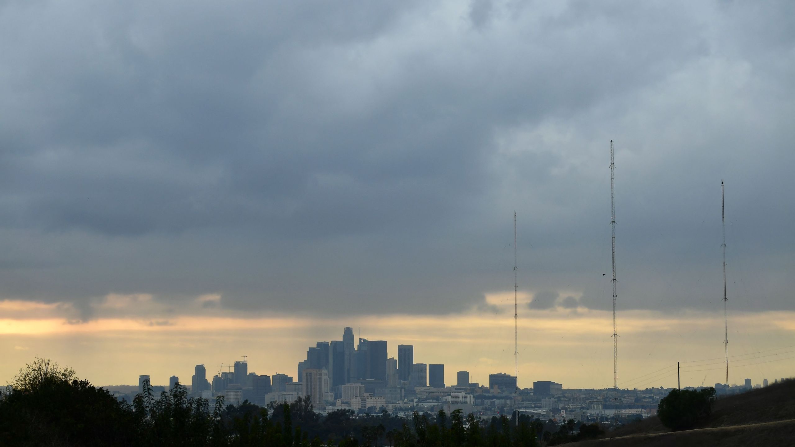 A storm cloud hovers over Los Angeles, California on December 13, 2021. (FREDERIC J. BROWN/AFP via Getty Images)