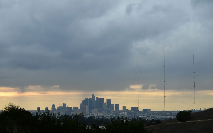 A storm cloud hovers over Los Angeles on Dec. 13, 2021. (FREDERIC J. BROWN/AFP via Getty Images)