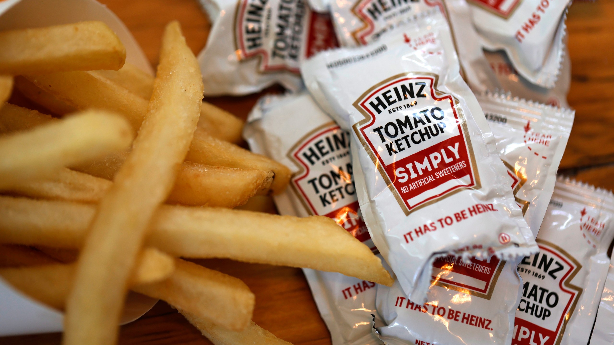 Packets of Heinz ketchup are displayed with Burger King french fries on April 12, 2021 in San Anselmo, California. (Justin Sullivan/Getty Images)