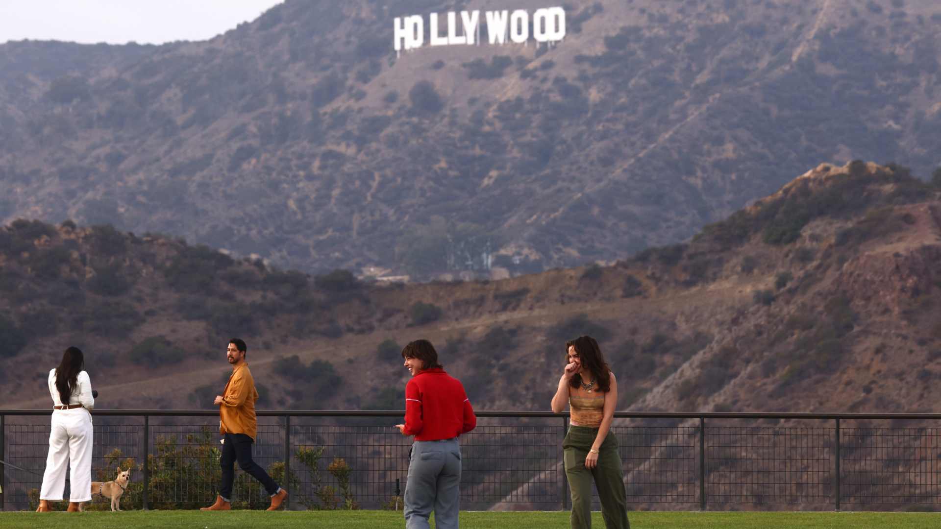 People gather in Griffith Park near the Hollywood sign on Oct. 7, 2021 in Los Angeles, California. (Mario Tama/Getty Images)