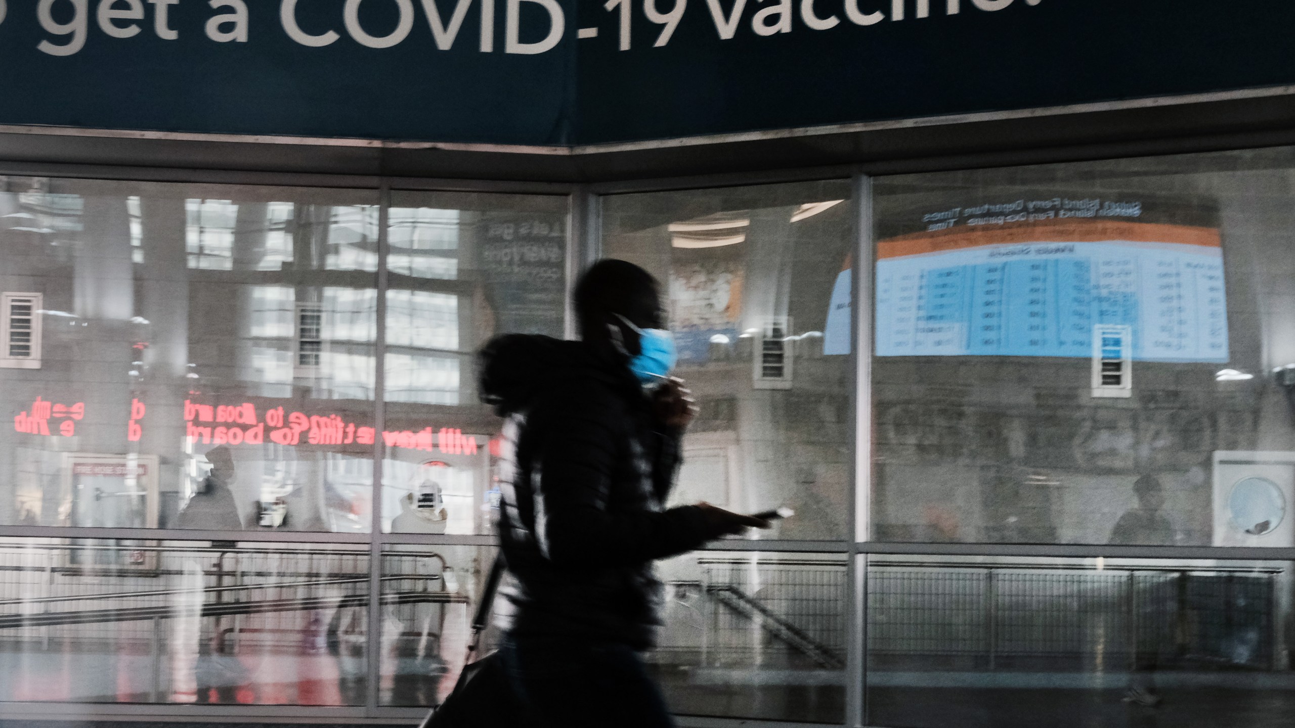 A sign urges people to get the COVID-19 vaccine at the Staten Island Ferry terminal on Nov. 29, 2021 in New York City. (Spencer Platt/Getty Images)