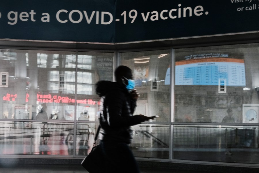 A sign urges people to get the COVID-19 vaccine at the Staten Island Ferry terminal on Nov. 29, 2021 in New York City. (Spencer Platt/Getty Images)