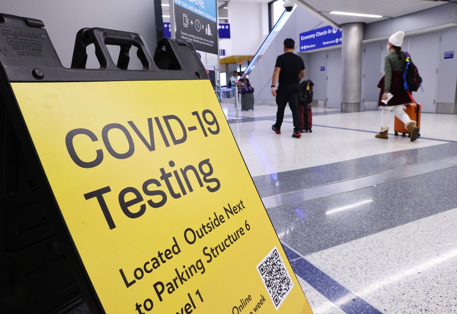 A sign promotes a COVID-19 testing location located inside the Tom Bradley International Terminal at Los Angeles International Airport (LAX) on Dec. 1, 2021 in Los Angeles, California. (Mario Tama/Getty Images)