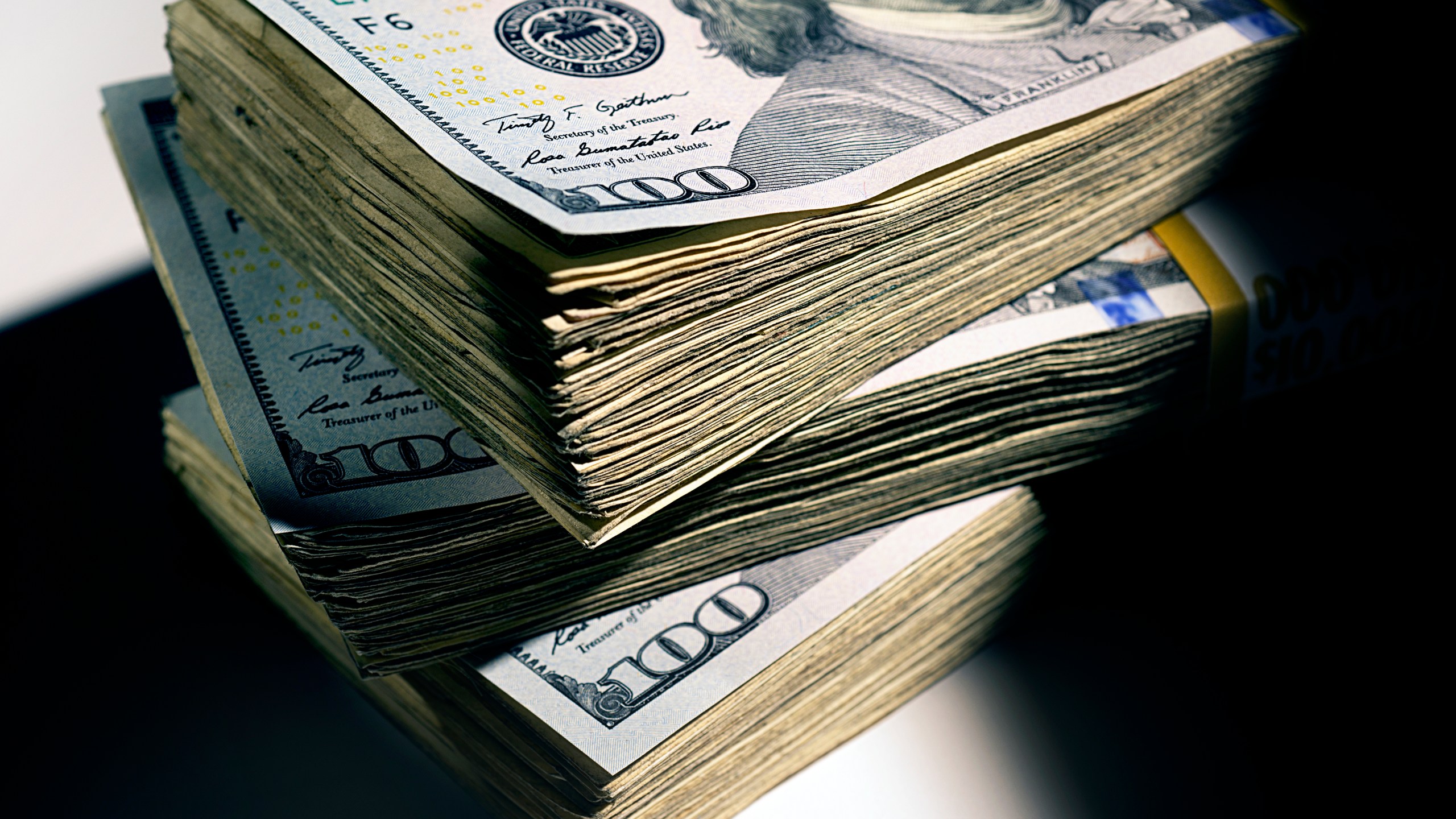 Stacks of cash are seen in a file photo. (iStock/Getty Images Plus)