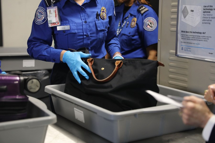 A Transportation Security Administration (TSA) worker screens luggage at LaGuardia Airport (LGA) on Sept. 26, 2017 in New York City. (Spencer Platt/Getty Images)