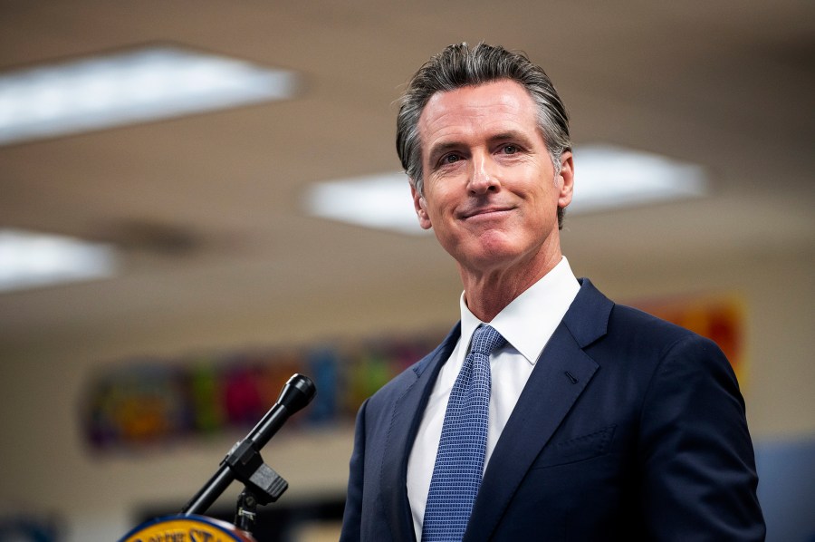 Gov. Gavin Newsom announces the confirmation of California's first case of the omicron variant of COVID-19 during a visit to a vaccination clinic at Frank Sparkes Elementary School in Winton, Calif., on Wednesday, Dec. 1, 2021. (Andrew Kuhn/The Merced Sun-Star via AP)