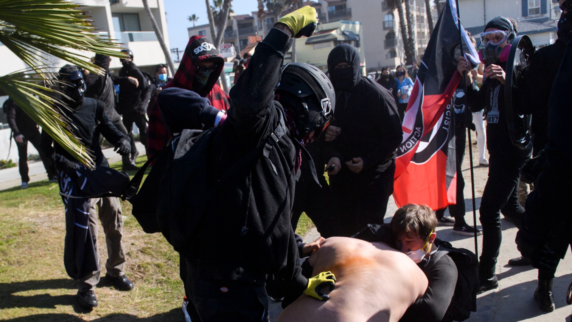 Counter-protesters clash with demonstrators (C) during a "Patriot March" demonstration in support of US President Donald Trump on January 9, 2021 in the Pacific Beach neighborhood of San Diego. (PATRICK T. FALLON/AFP via Getty Images)