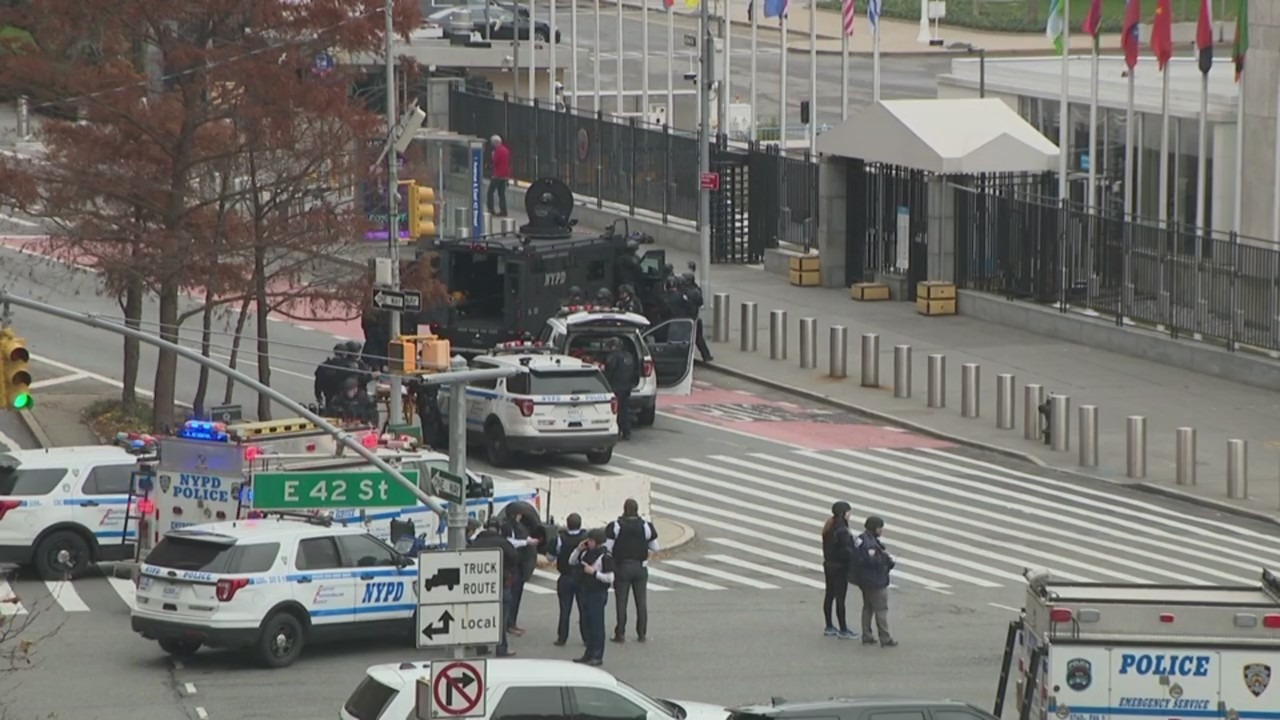 Police are seen outside the United Nations as a man points a gun at his head on Dec. 2, 2021. (PIX11 News)