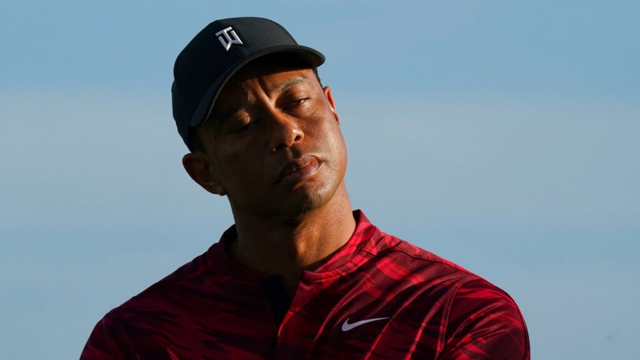 Tiger Woods gestures during the trophy ceremony of the Hero World Challenge PGA Tour at the Albany Golf Club, in New Providence, Bahamas, Sunday, Dec. 5, 2021.(AP Photo/Fernando Llano)