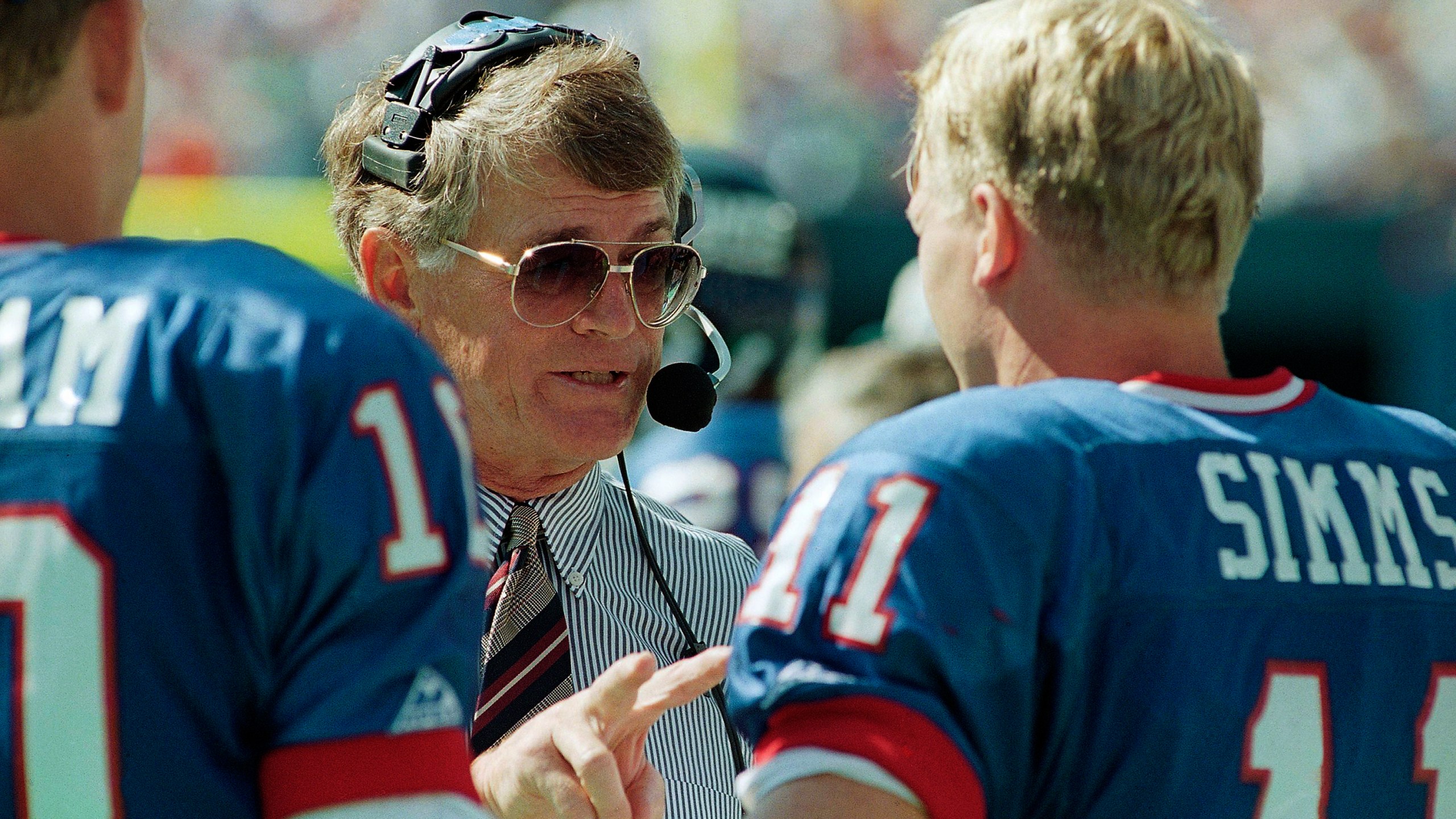 New York Giants head coach Dan Reeves gives some instructions to his starting quarterback Phil Simms during the third quarter of their game against the Tampa Bay Buccaneers at Giants Stadium in East Rutherford, N.J. on Sept. 12, 1993. (Mark Lennihan/Associated Press)