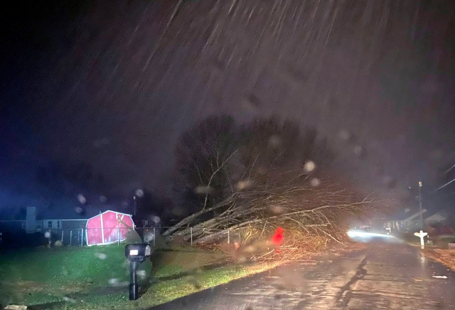 This photo provided by Madison County Sheriff's Office, authorities closed down a road after power lines came down and homes suffered damage early Sunday, Jan. 2, 2022 in Hazel Green, Ala. The storms followed a system earlier Saturday which brought a possible tornado and flooding to parts of Kentucky. (Madison County Sheriff's Office via AP)