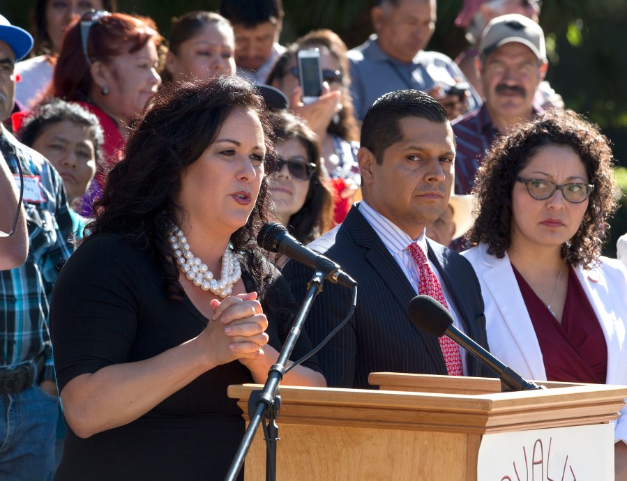 Assemblywoman Lorena Gonzalez, left, speaks at a rally in Sacramento on Aug. 25, 2016. (Rich Pedroncelli/Associated Press)