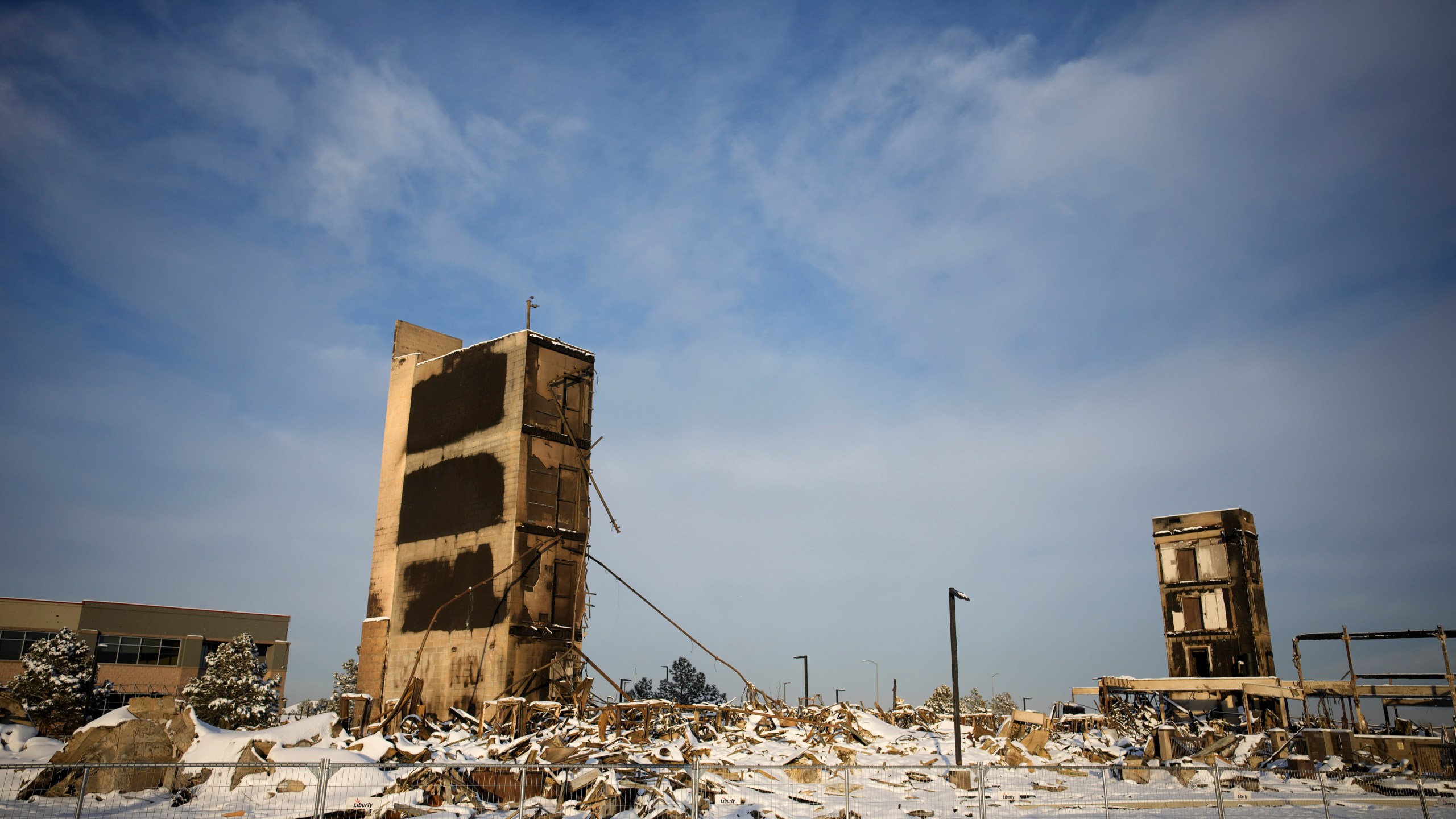 The charred remains of an Element Hotel destroyed by wildfires is seen on Jan. 6, 2022, in Superior, Colo. (David Zalubowski/Associated Press)