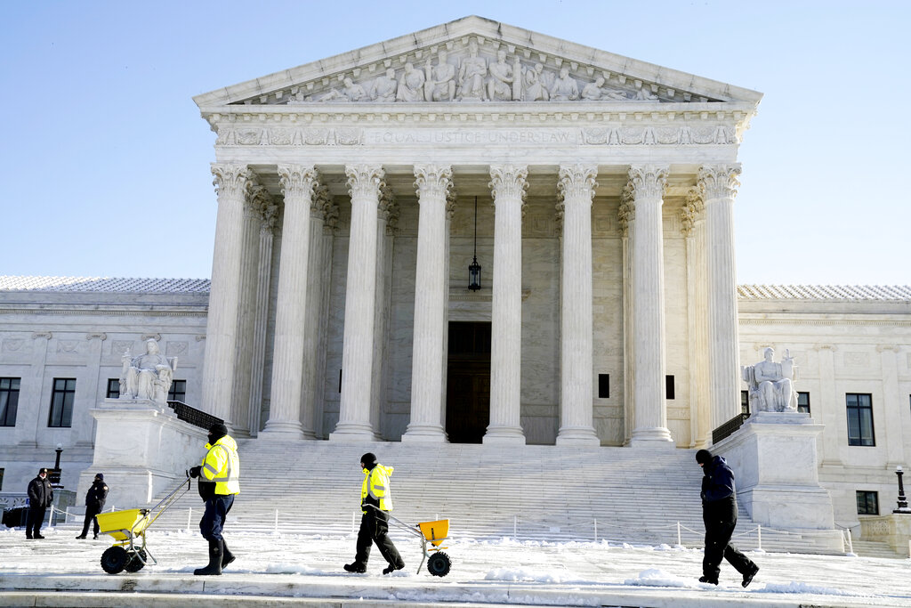 The Supreme Court shown Friday, Jan. 7, 2022, in Washington. The Supreme Court has stopped the Biden administration from enforcing a requirement that employees at large businesses be vaccinated against COVID-19 or undergo weekly testing and wear a mask on the job. The court's order Thursday during a spike in coronavirus cases deals a blow to the administration's efforts to boost the vaccination rate among Americans. (AP Photo/Evan Vucci, File)