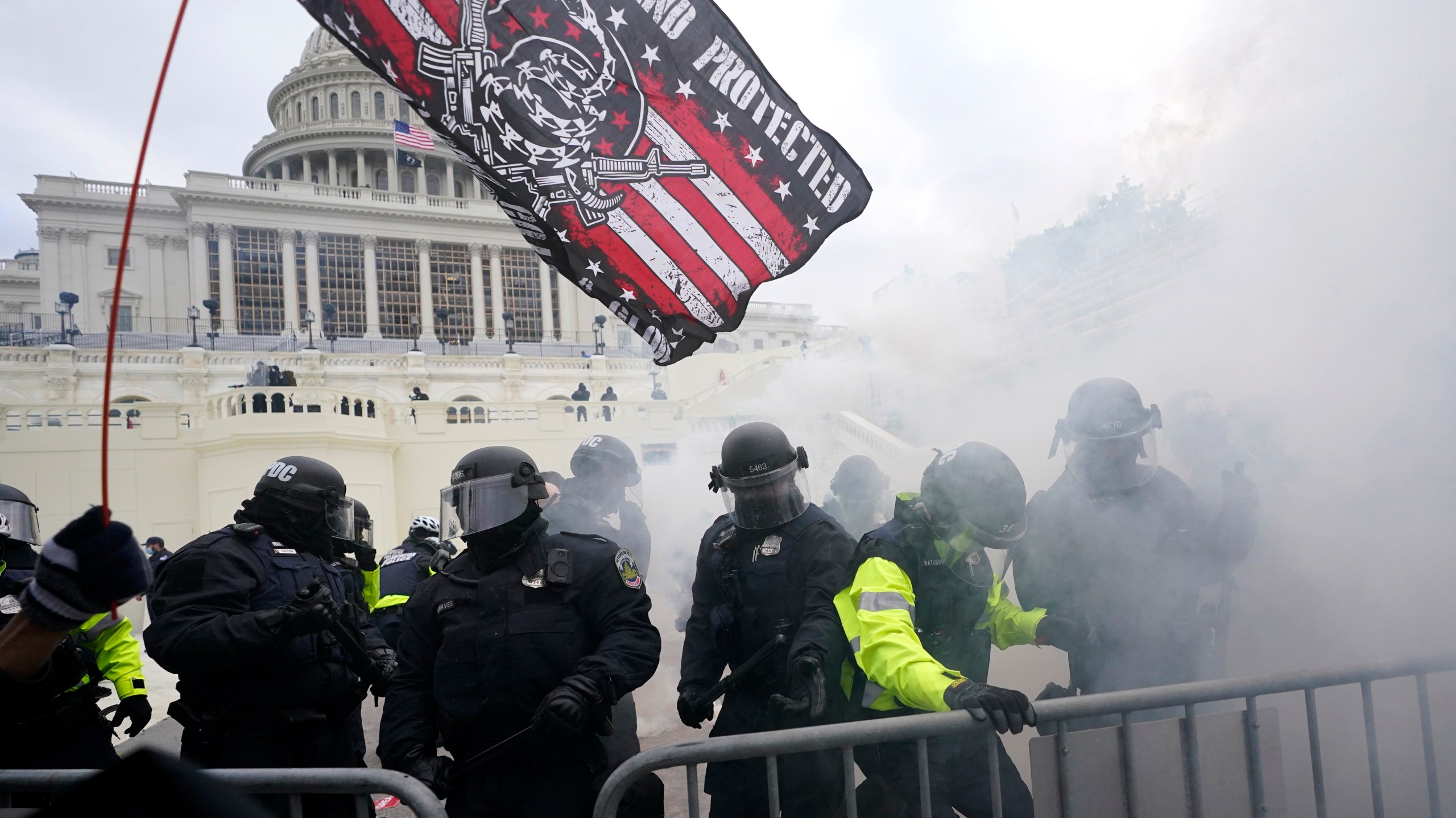 Police hold off violent insurrections loyal to then-President Donald Trump as they try to break through a police barrier Jan. 6, 2021, at the Capitol in Washington. (AP Photo/Julio Cortez, File)