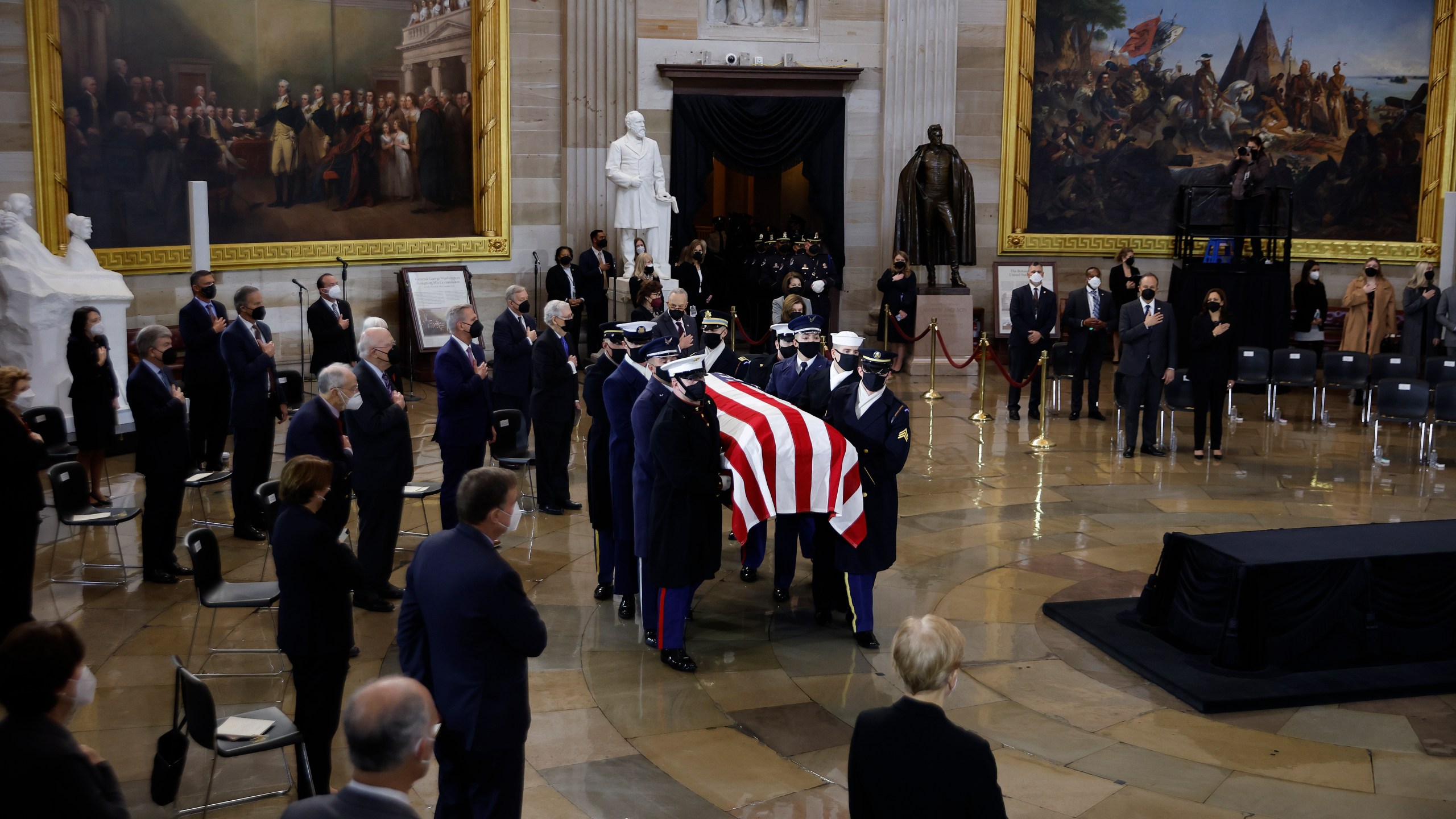 A U.S. Joint Forces bearer team carries the flag-draped casket of former Senate Majority Leader Harry Reid, D-Nev., into the Rotunda of the U.S. Capitol where he will lie in state on Jan. 12, 2022. (Chip Somodevilla/Pool via AP)