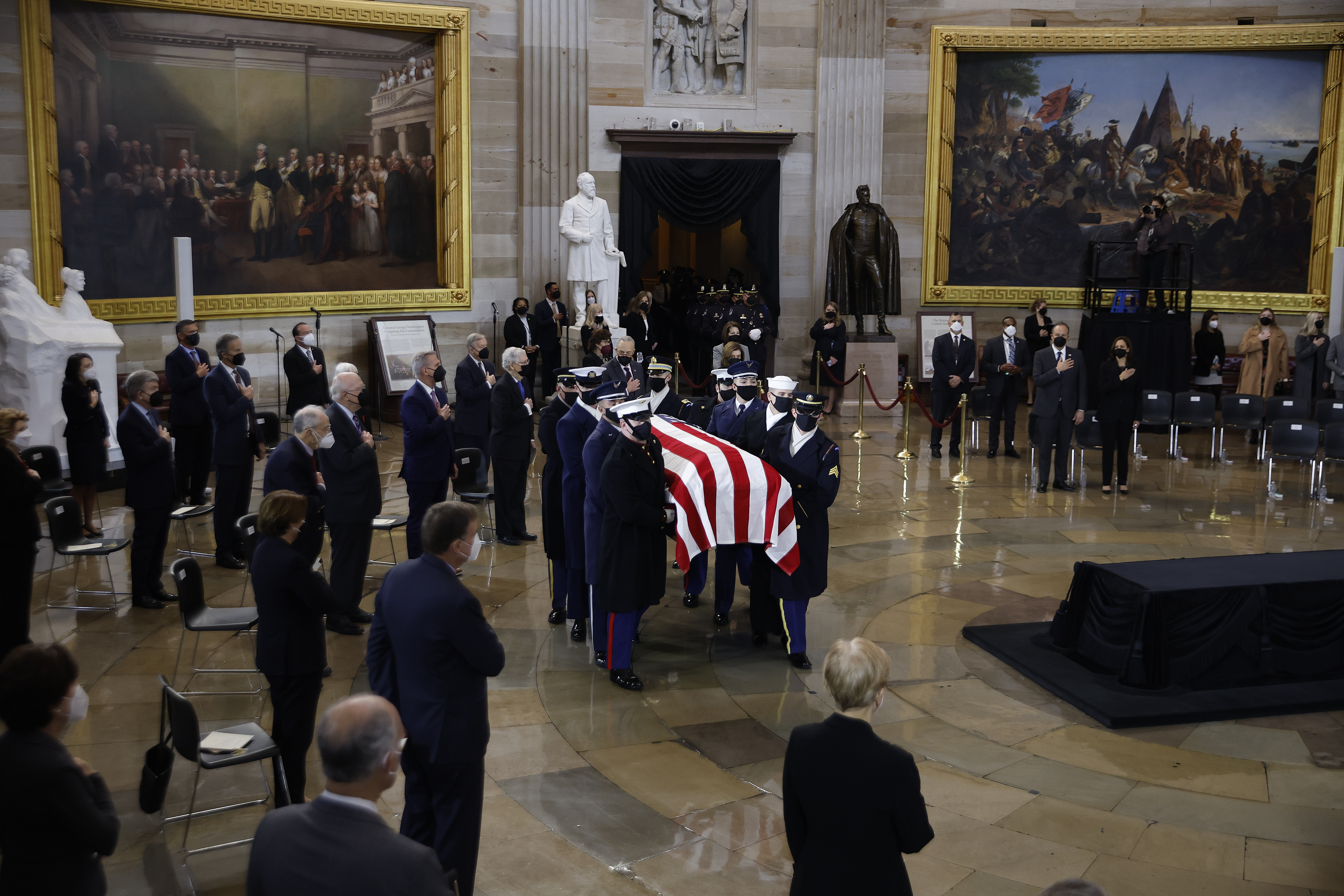 A U.S. Joint Forces bearer team carries the flag-draped casket of former Senate Majority Leader Harry Reid, D-Nev., into the Rotunda of the U.S. Capitol where he will lie in state on Jan. 12, 2022. (Chip Somodevilla/Pool via AP)