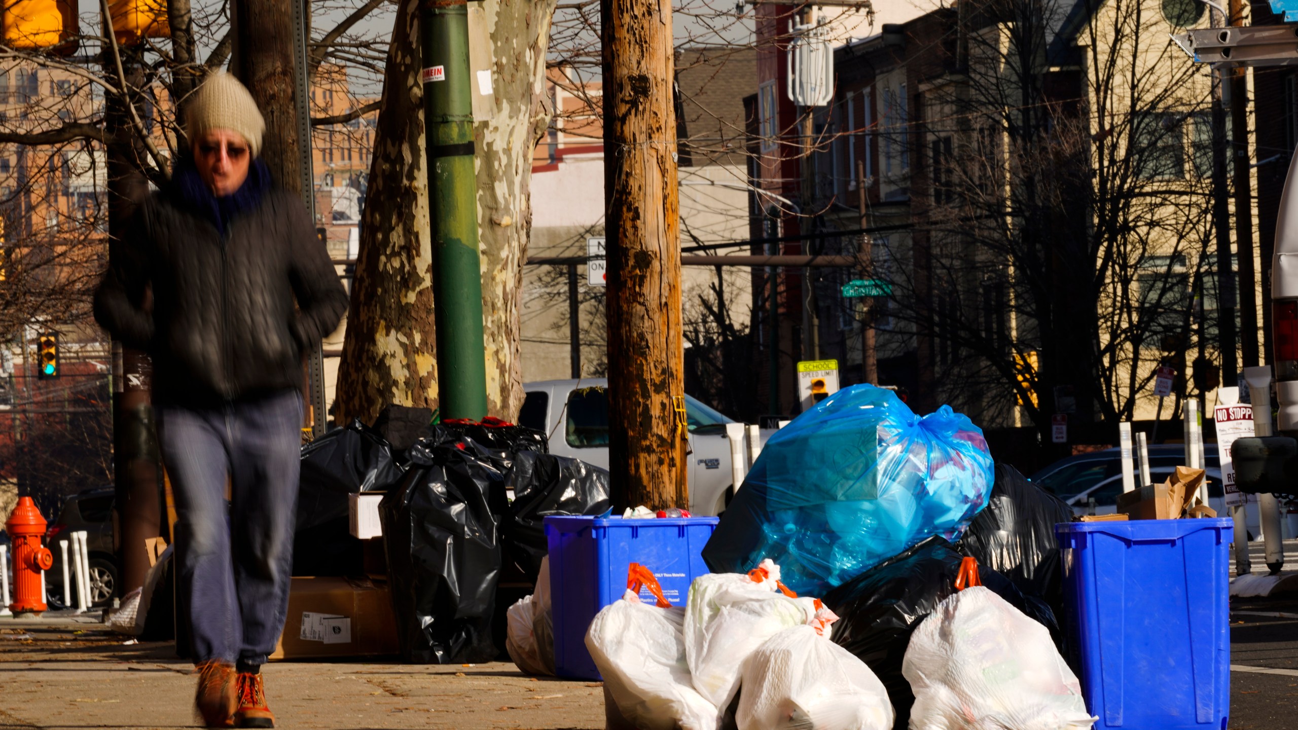 Trash sits out for collection in Philadelphia on Jan. 13, 2022. (Matt Rourke/Associated Press)