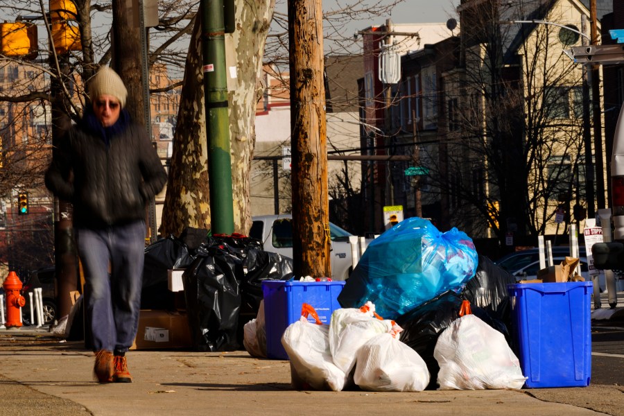 Trash sits out for collection in Philadelphia on Jan. 13, 2022. (Matt Rourke/Associated Press)