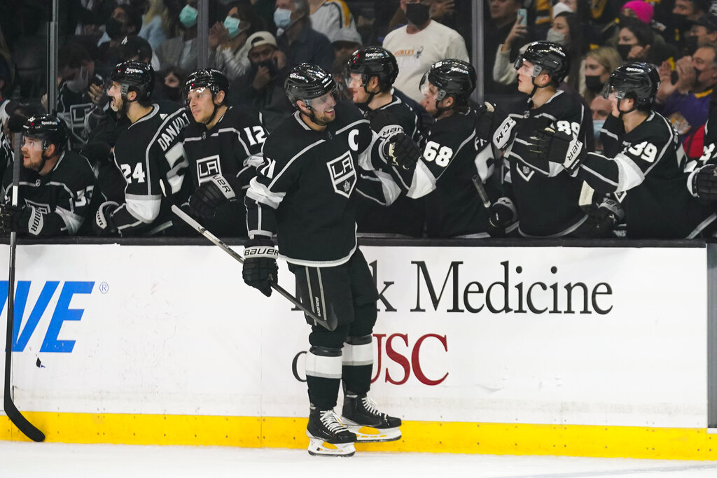 Los Angeles Kings' Anze Kopitar, center, celebrates his goal against the Pittsburgh Penguins during the first period of an NHL hockey game Thursday, Jan. 13, 2022, in Los Angeles. (AP Photo/Jae C. Hong)