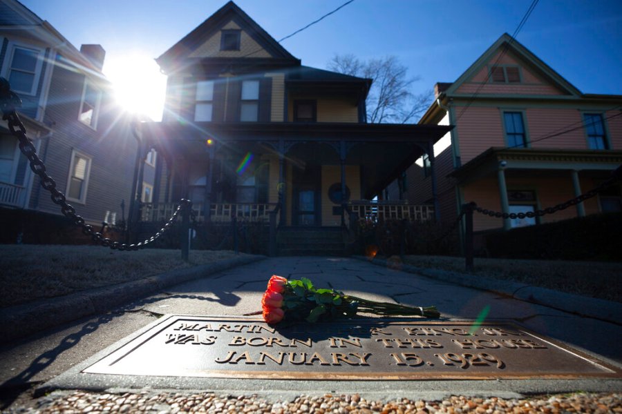 Flowers lay in front of the birthplace of Dr. Martin Luther King, Jr., on Jan. 18, 2021, in Atlanta. (AP Photo/Branden Camp, File)