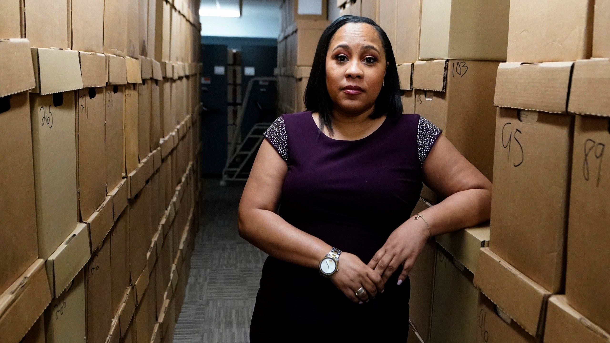 Fulton County District Attorney Fani Willis poses for a photo at her office, Feb. 24, 2021 in Atlanta. The Georgia prosecutor who’s investigating possible attempts to interfere in the 2020 general election by former President Donald Trump and others has asked for a special grand jury to aid the investigation. Willis, on Thursday, Jan. 20, 2022, sent a letter to Fulton County Superior Court Chief Judge Christopher Brasher asking him to impanel a special grand jury. (AP Photo/John Bazemore, File)