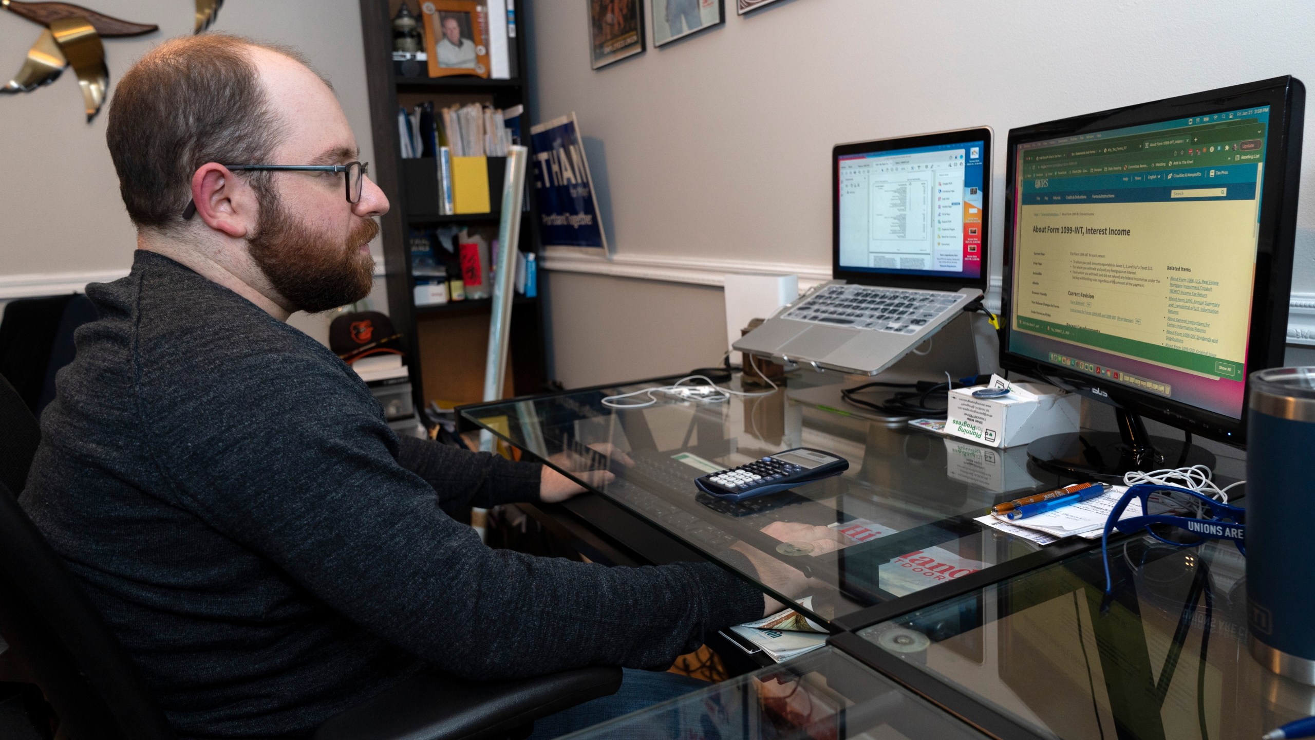 Ethan Miller works on his taxes at home in Silver Spring, Md., Friday, Jan., 21, 2022. (AP Photo/Jacquelyn Martin)