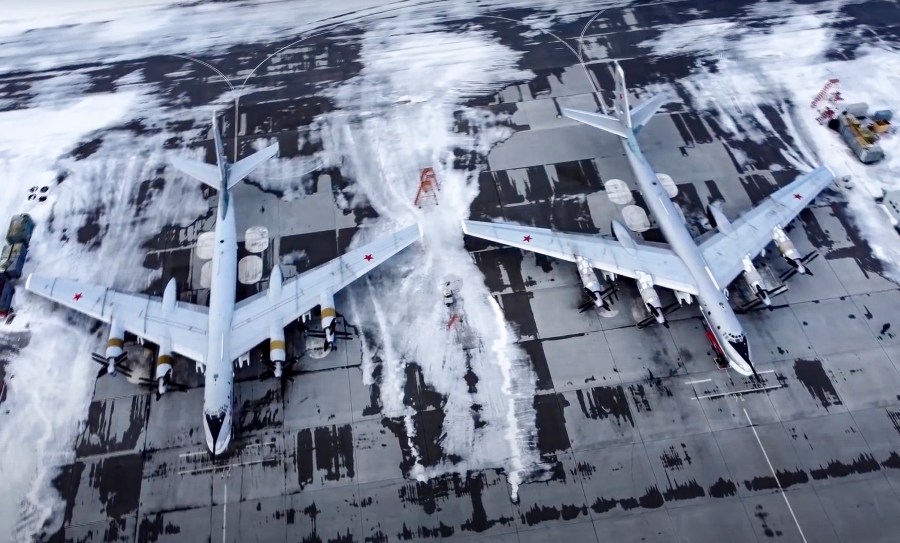 In this image taken from video provided by the Russian Defense Ministry Press Service, a pair of Tu-95 strategic bombers of the Russian air force are parked at an air base in Engels near the Volga River in Russia on Jan. 24, 2022.(Russian Defense Ministry Press Service via AP)