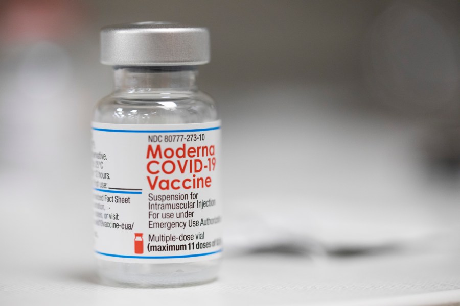 A vial of the Moderna COVID-19 vaccine is displayed on a counter at a pharmacy in Portland, Ore., Monday, Dec. 27, 2021. (AP Photo/Jenny Kane)