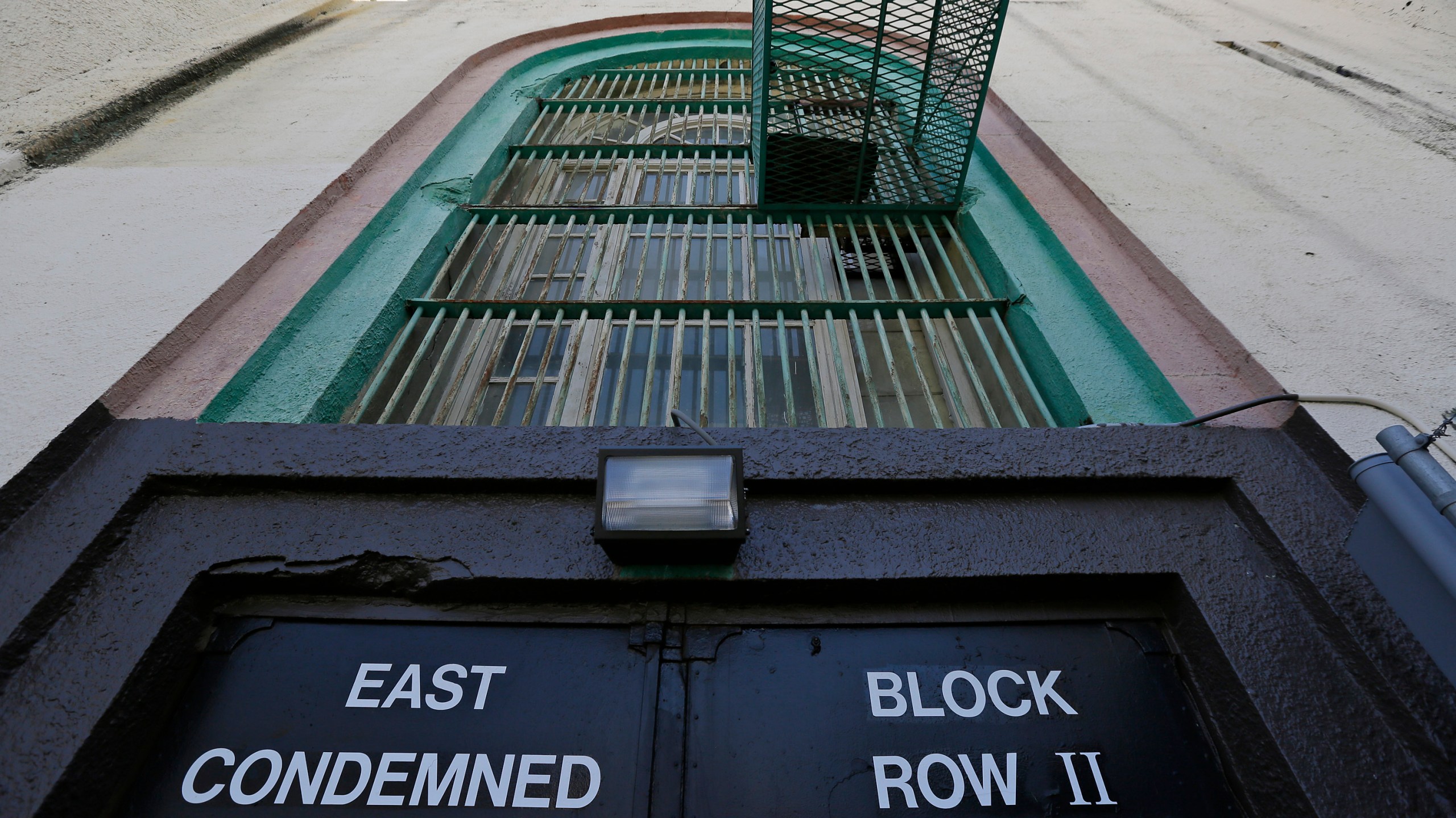 Shown is the entrance to the east block of death row at San Quentin State Prison, Aug. 16, 2016, in San Quentin, Calif. California Gov. Gavin Newsom is moving to dismantle the nation's largest death row by moving all condemned inmates to other prisons with in two years. The goal is to turn the section of San Quentin State Prison into "a positive, healing environment." (AP Photo/Eric Risberg, File)