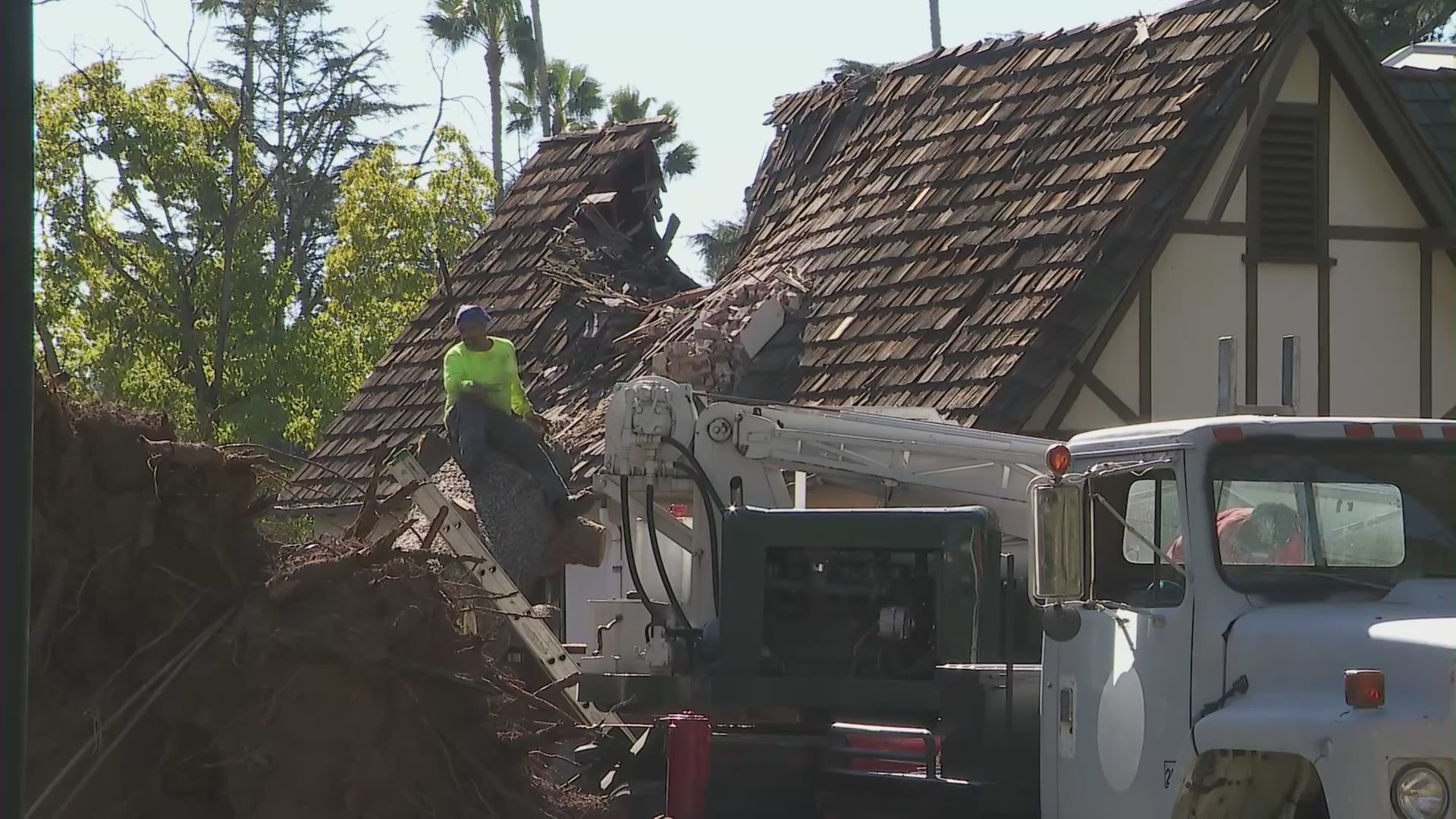 The tree left a gaping hole in the Altadena home's roof. (KTLA)